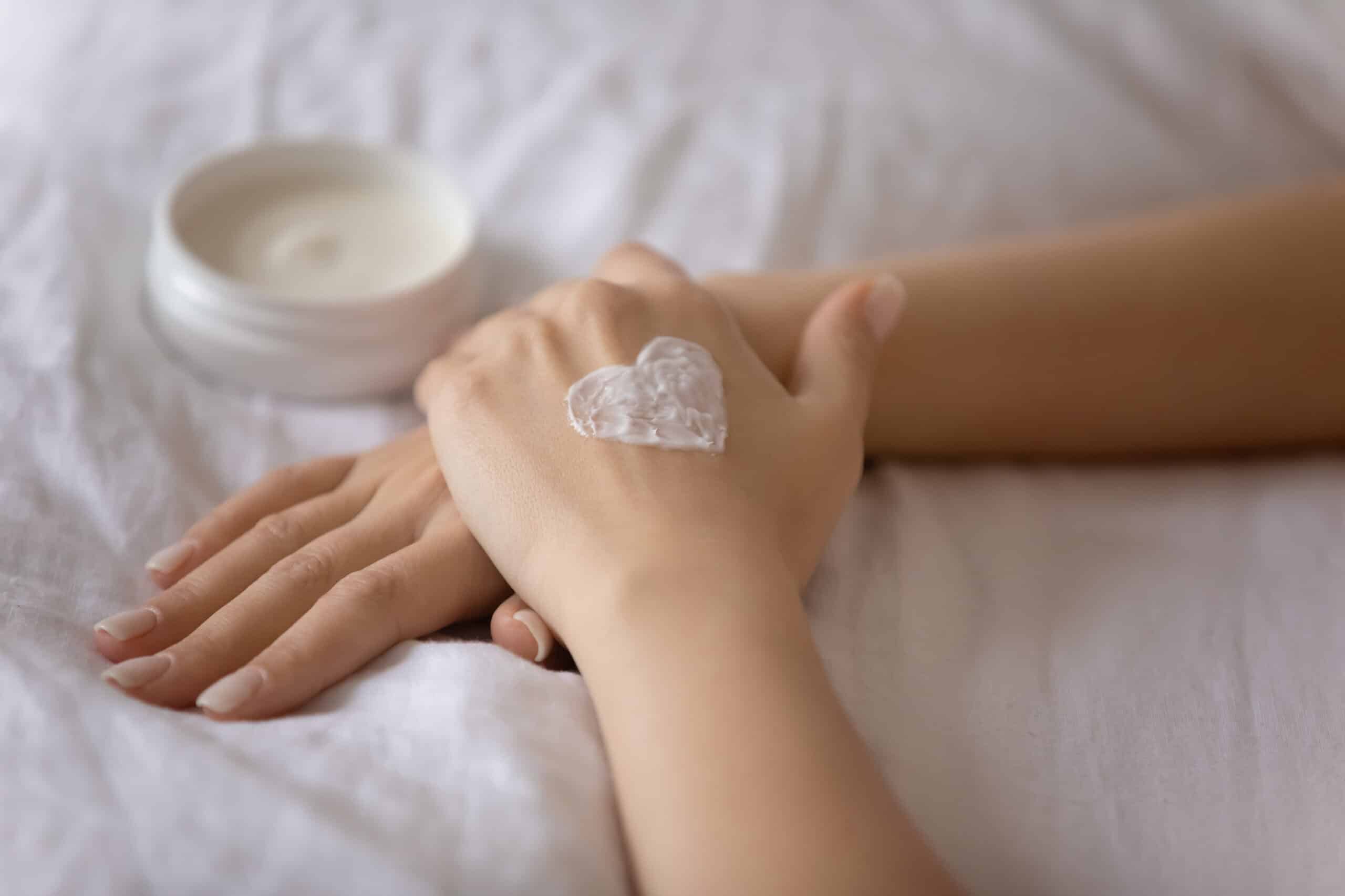 Hands with a heart of shea butter moisturizing